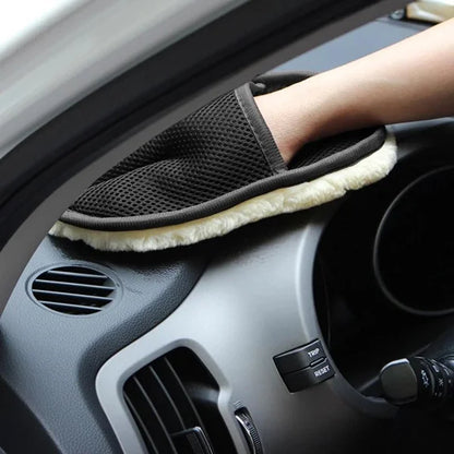 Person cleaning car dashboard with a microfiber cleaning glove